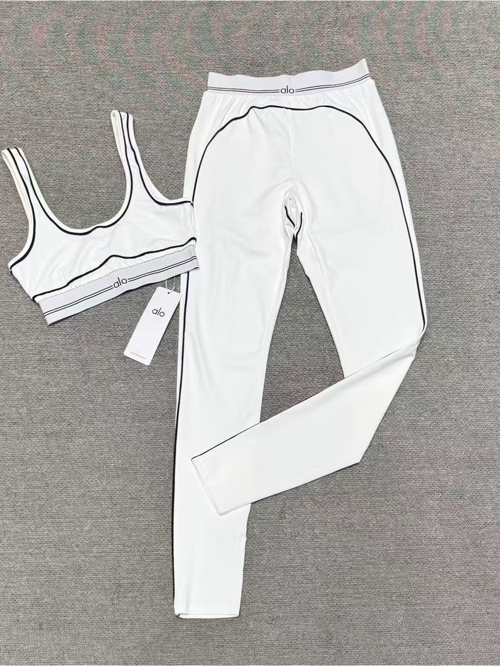 ALO Yoga White Sports Bra and Leggings Set with Black Trim